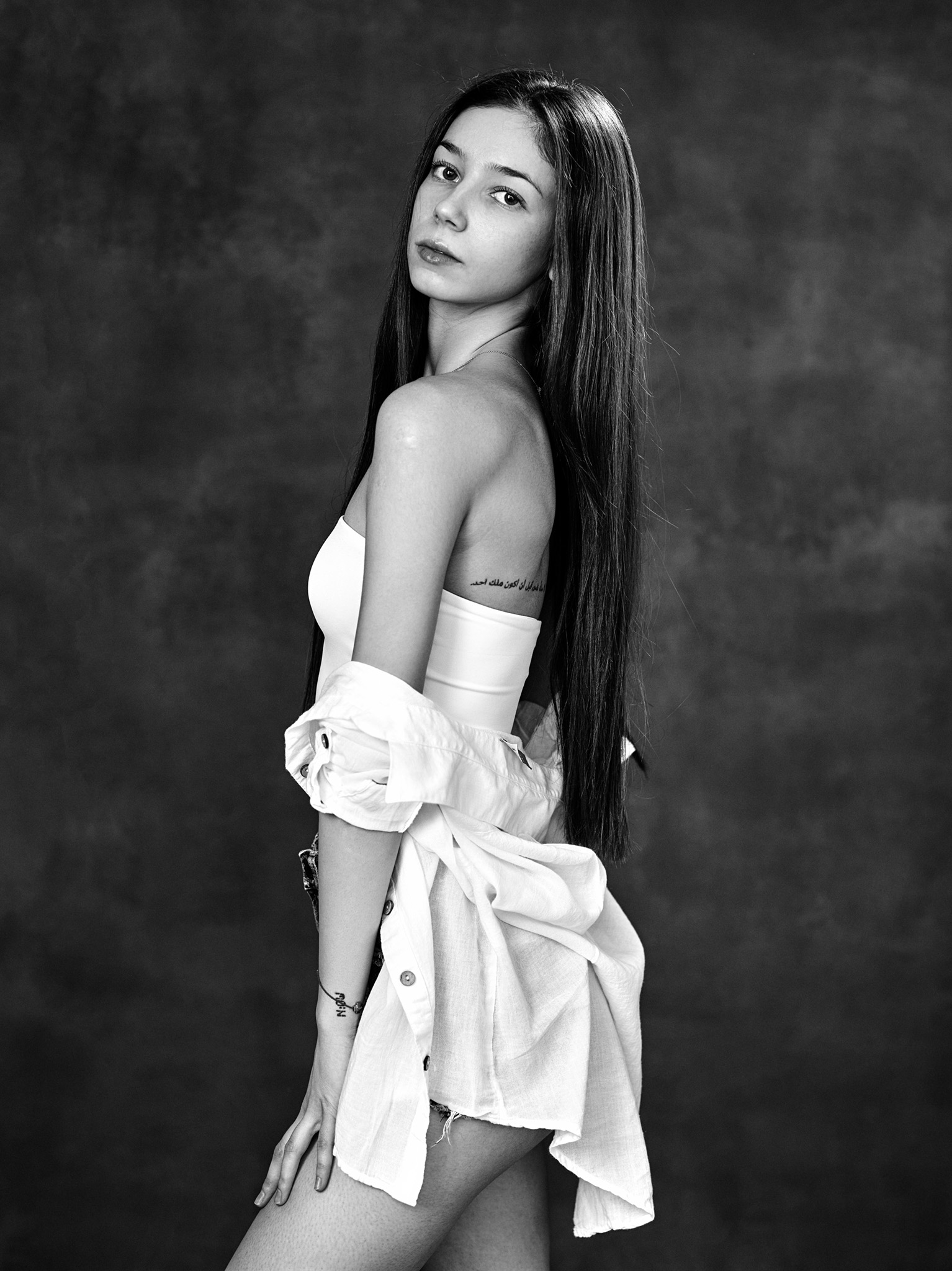 Black and white portrait of a young woman with long hair